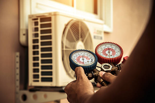 Professional Air Conditioning Service technician working in Red Rock, AZ
